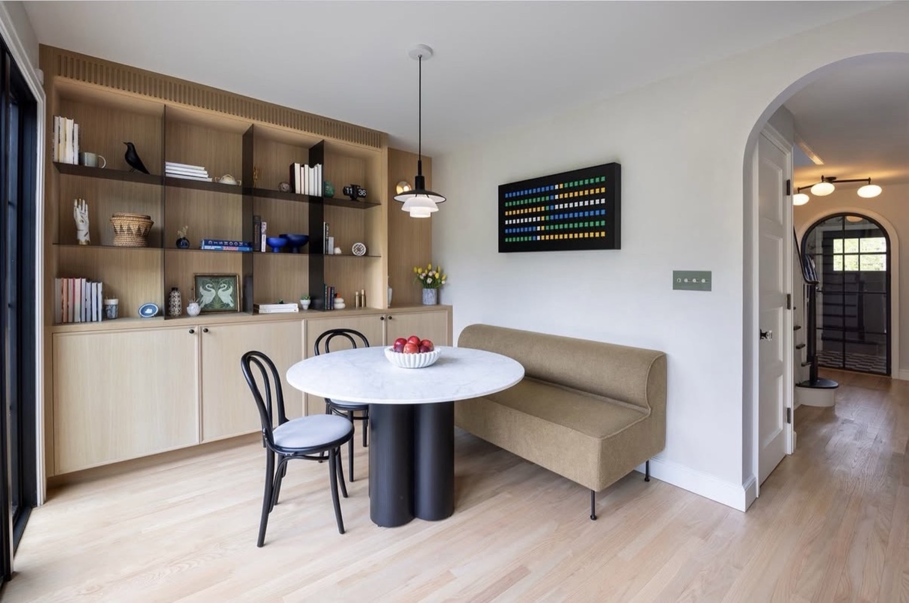Dining nook with custom wood built-in shelving