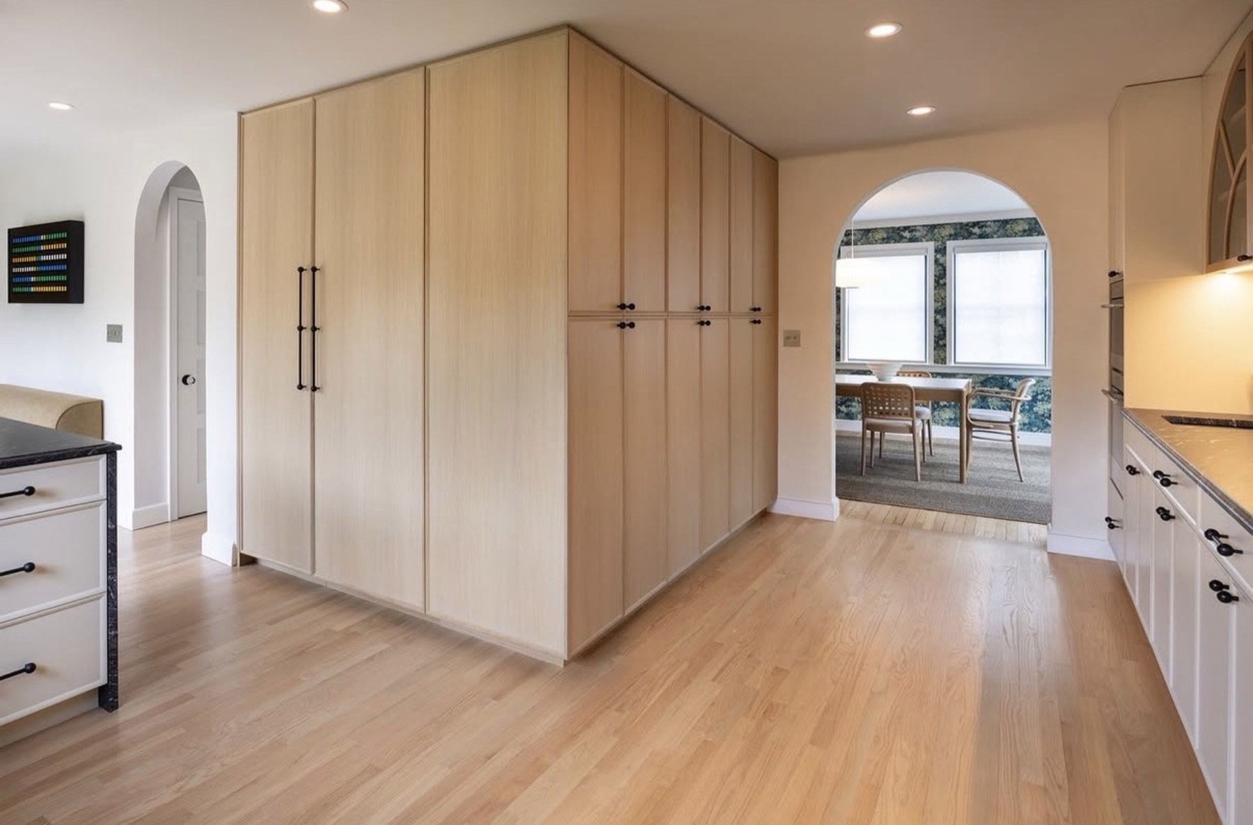 Custom wood pantry wall millwork in a remodeled kitchen