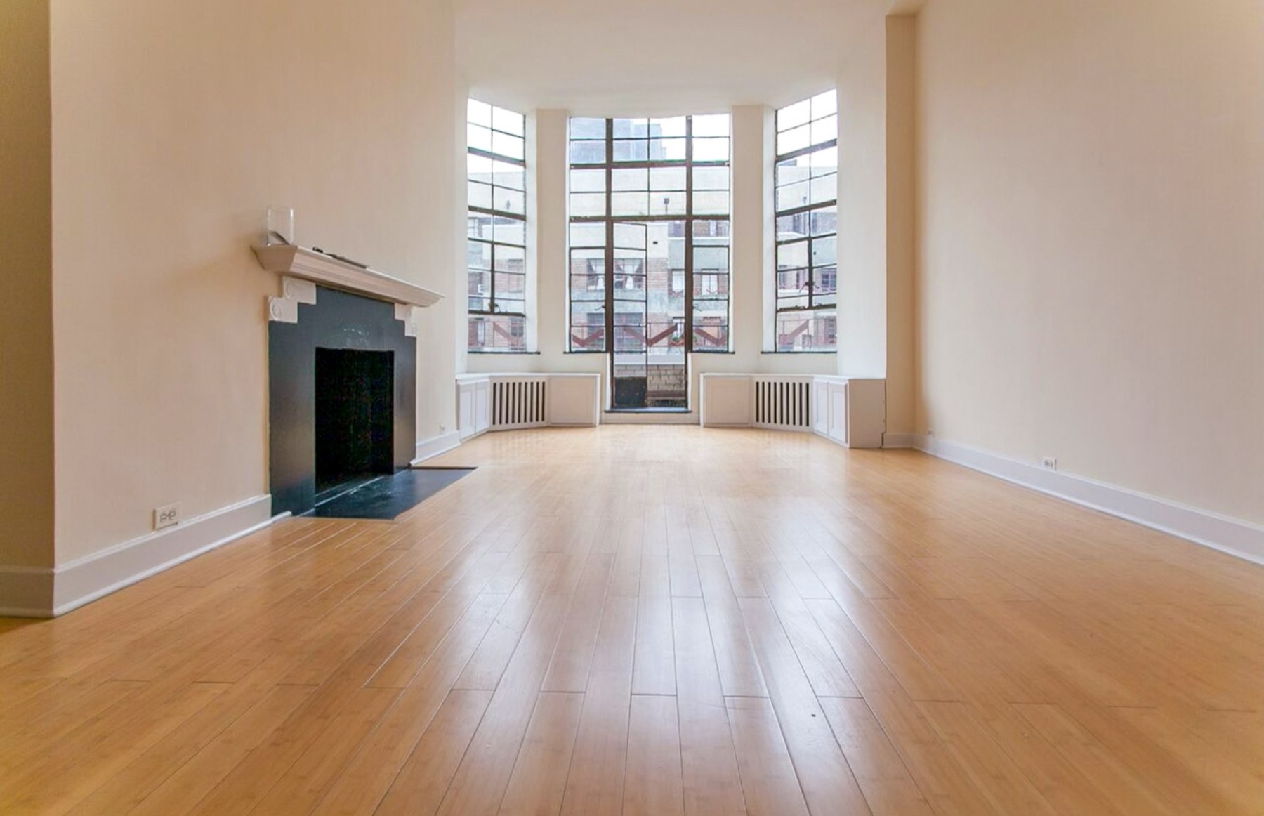 Living room remodel with expanded bay windows and fireplace